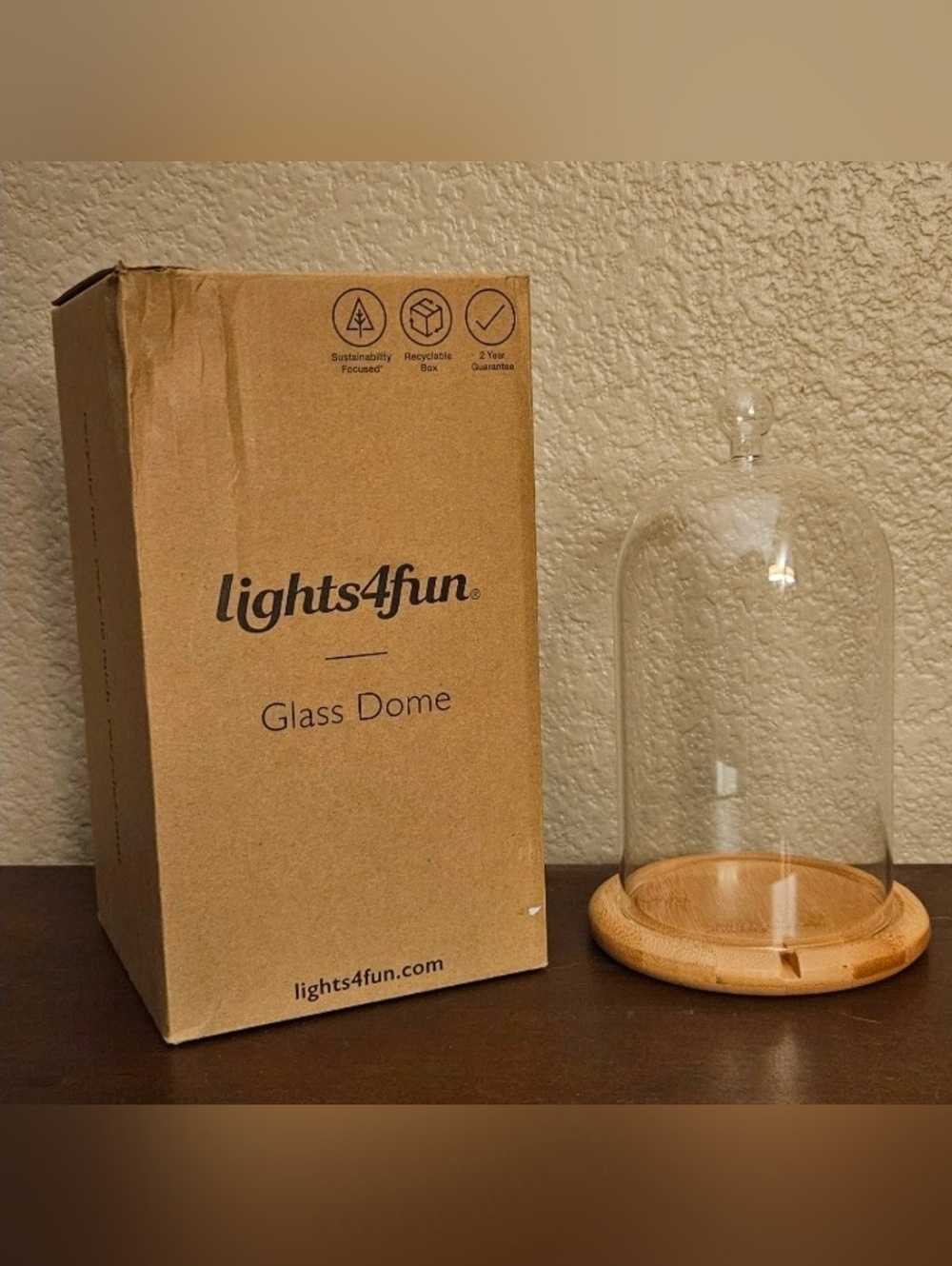 Lights4fun Glass Dome with a wooden base.